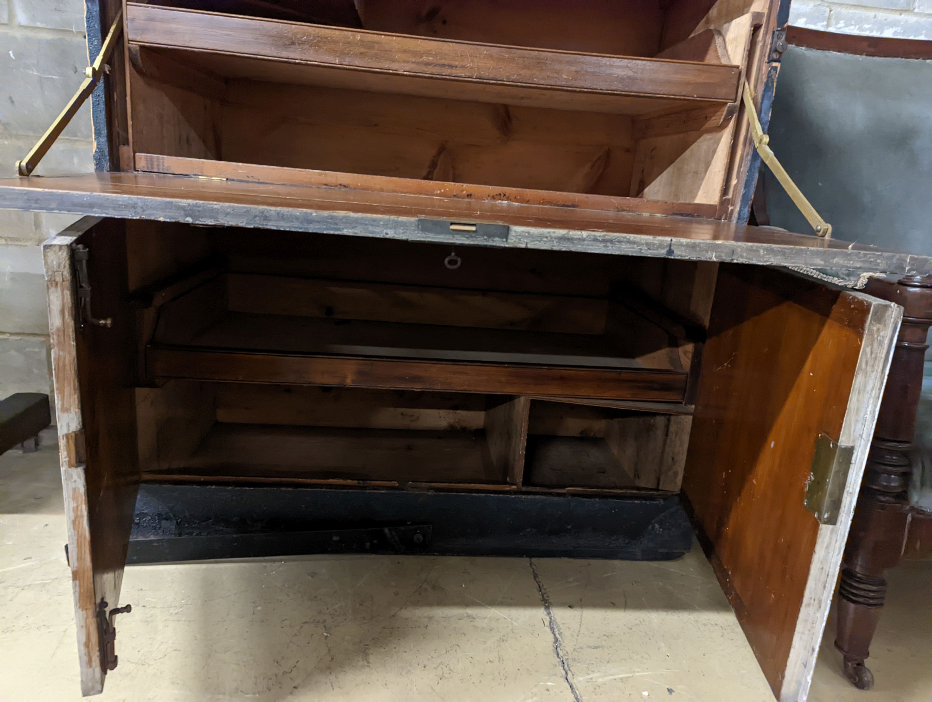 An early 20th century painted and stained pine campaign chest - owners name plate for W.E Higham, R.N. , retailers name plate Gieve’s. W-106cm, D-54cm, H-114cm.